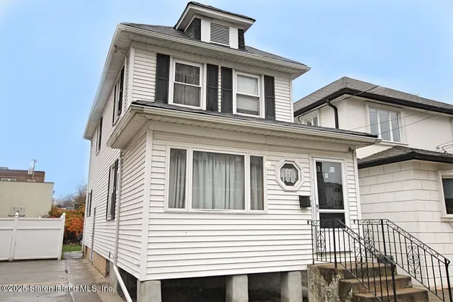 a front view of a house with a balcony