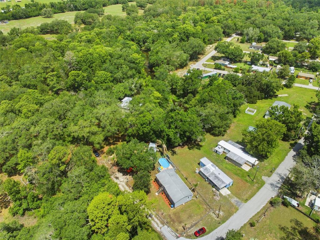 3183 Cedley Road Dade City, FL 33523 - Photo 30 of 48 an aerial view of residential house with outdoor space and trees all around