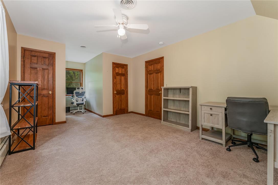 465 Raubsville Road Easton, PA 18042 - Photo 43 of 60 A spacious room offers flexible living, featuring soft carpeting and a ceiling fan for comfort.