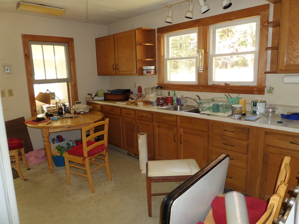 204 Ireland Street Chesterfield, MA 01084 - Photo 15 of 25 a kitchen with a table chairs sink and cabinets