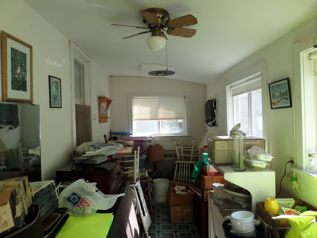 204 Ireland Street Chesterfield, MA 01084 - Photo 17 of 25 a room with furniture a chandelier fan and a window