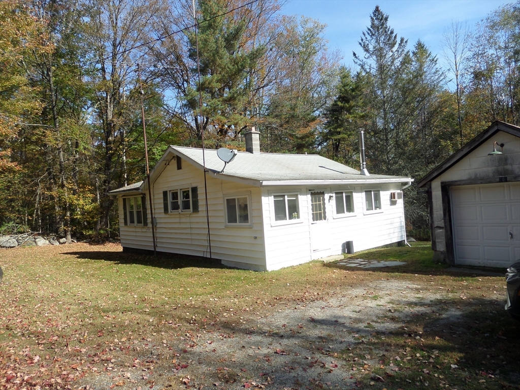 204 Ireland Street Chesterfield, MA 01084 - Photo 2 of 25 a white house that has a tree in front of it