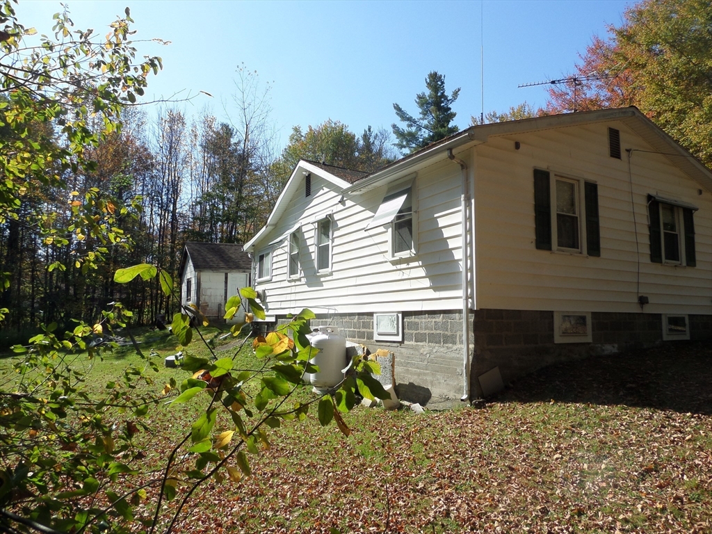 204 Ireland Street Chesterfield, MA 01084 - Photo 7 of 25 a front view of a house with a tree