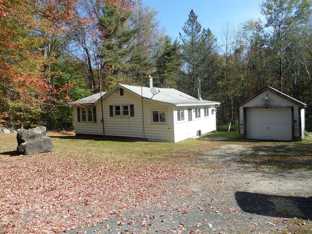 204 Ireland Street Chesterfield, MA 01084 - Photo 8 of 25 a front view of a house with a garden and yard