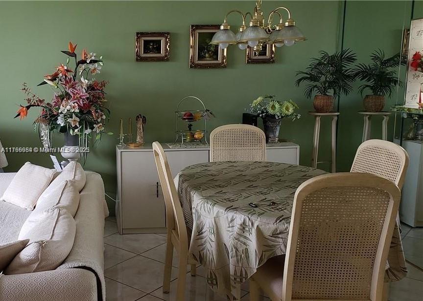 3821 Environ Boulevard, Unit 406 Lauderhill, FL 33319 - Photo 13 of 23 a dining room with furniture and a potted plant