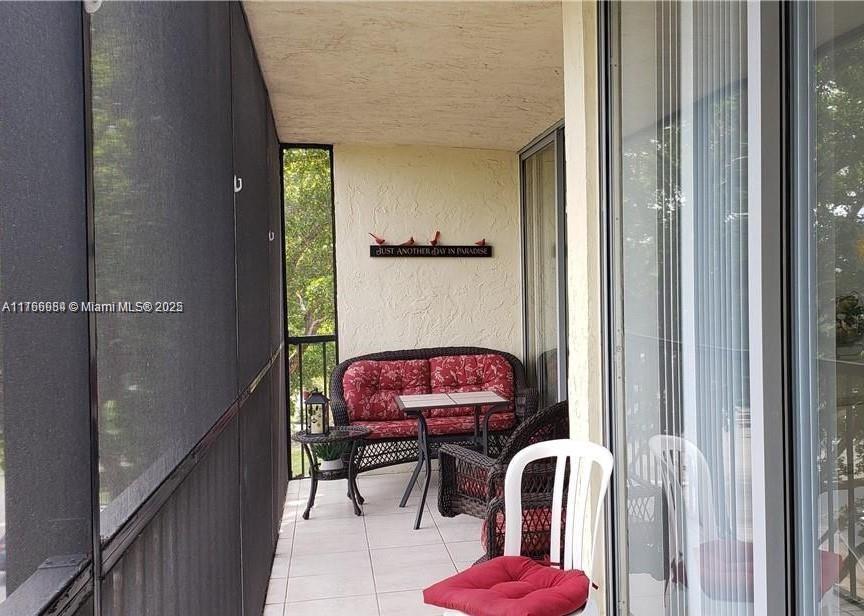 3821 Environ Boulevard, Unit 406 Lauderhill, FL 33319 - Photo 17 of 23 a view of a hallway with chairs