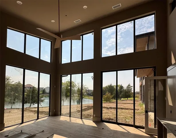 a view of an empty room with a large window
