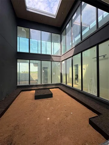 a view of an empty room with a large window