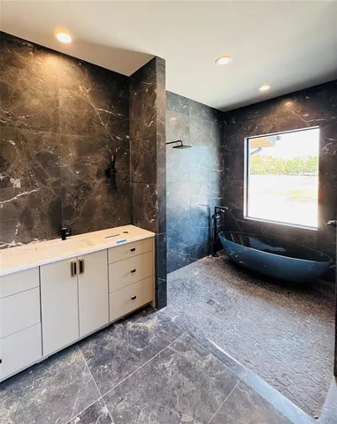 a bathroom with a sink a toilet and a bathtub