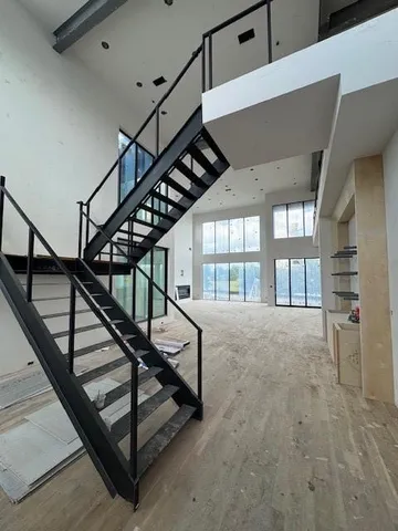a view of an entryway wooden floor and a window