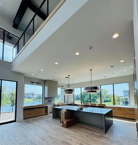 a living room with kitchen island furniture and a large window