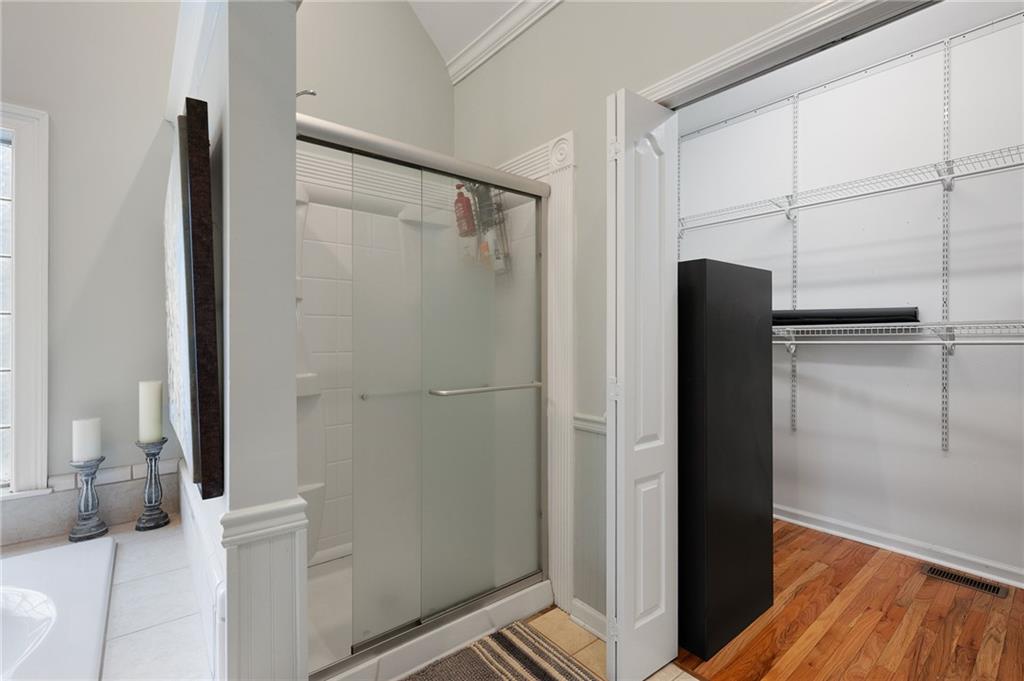 425 McDaniel Station Road Southwest Calhoun, GA 30701 - Photo 20 of 46 a view of bathroom with a tub and shower