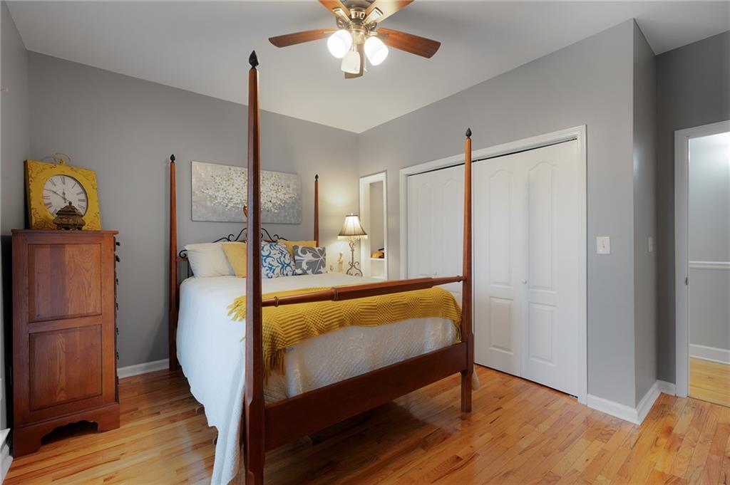 425 McDaniel Station Road Southwest Calhoun, GA 30701 - Photo 22 of 46 a bedroom with a bed and wooden floor