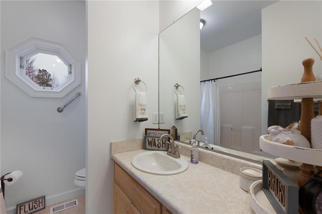 425 McDaniel Station Road Southwest Calhoun, GA 30701 - Photo 23 of 46 a bathroom with a sink vanity and a mirror
