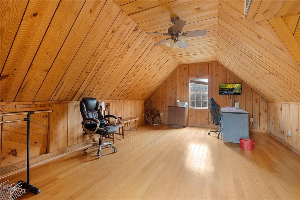 425 McDaniel Station Road Southwest Calhoun, GA 30701 - Photo 29 of 46 a view of a livingroom with furniture and a ceiling fan