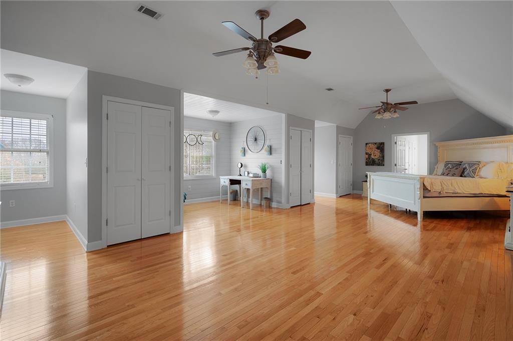 425 McDaniel Station Road Southwest Calhoun, GA 30701 - Photo 31 of 46 a view of a livingroom with furniture a ceiling fan and hardwood floor