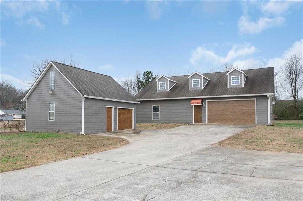 425 McDaniel Station Road Southwest Calhoun, GA 30701 - Photo 35 of 46 a front view of a house with a yard
