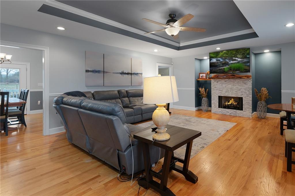 425 McDaniel Station Road Southwest Calhoun, GA 30701 - Photo 4 of 46 a living room with furniture and a fireplace