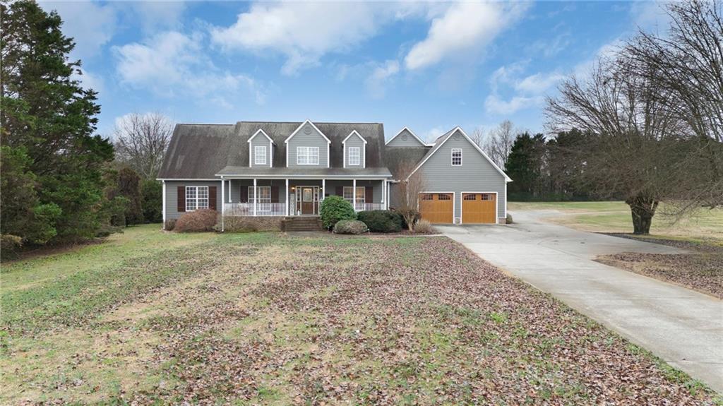 425 McDaniel Station Road Southwest Calhoun, GA 30701 - Photo 43 of 46 a front view of a house with a yard and garage