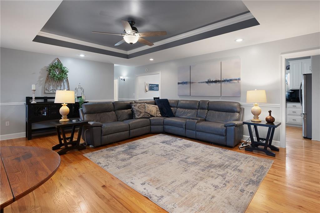 425 McDaniel Station Road Southwest Calhoun, GA 30701 - Photo 6 of 46 a living room with furniture and a wooden floor
