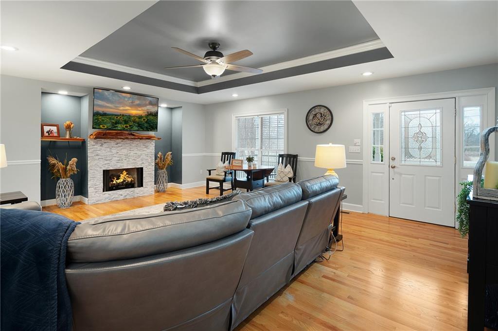 425 McDaniel Station Road Southwest Calhoun, GA 30701 - Photo 8 of 46 a living room with furniture and a fireplace