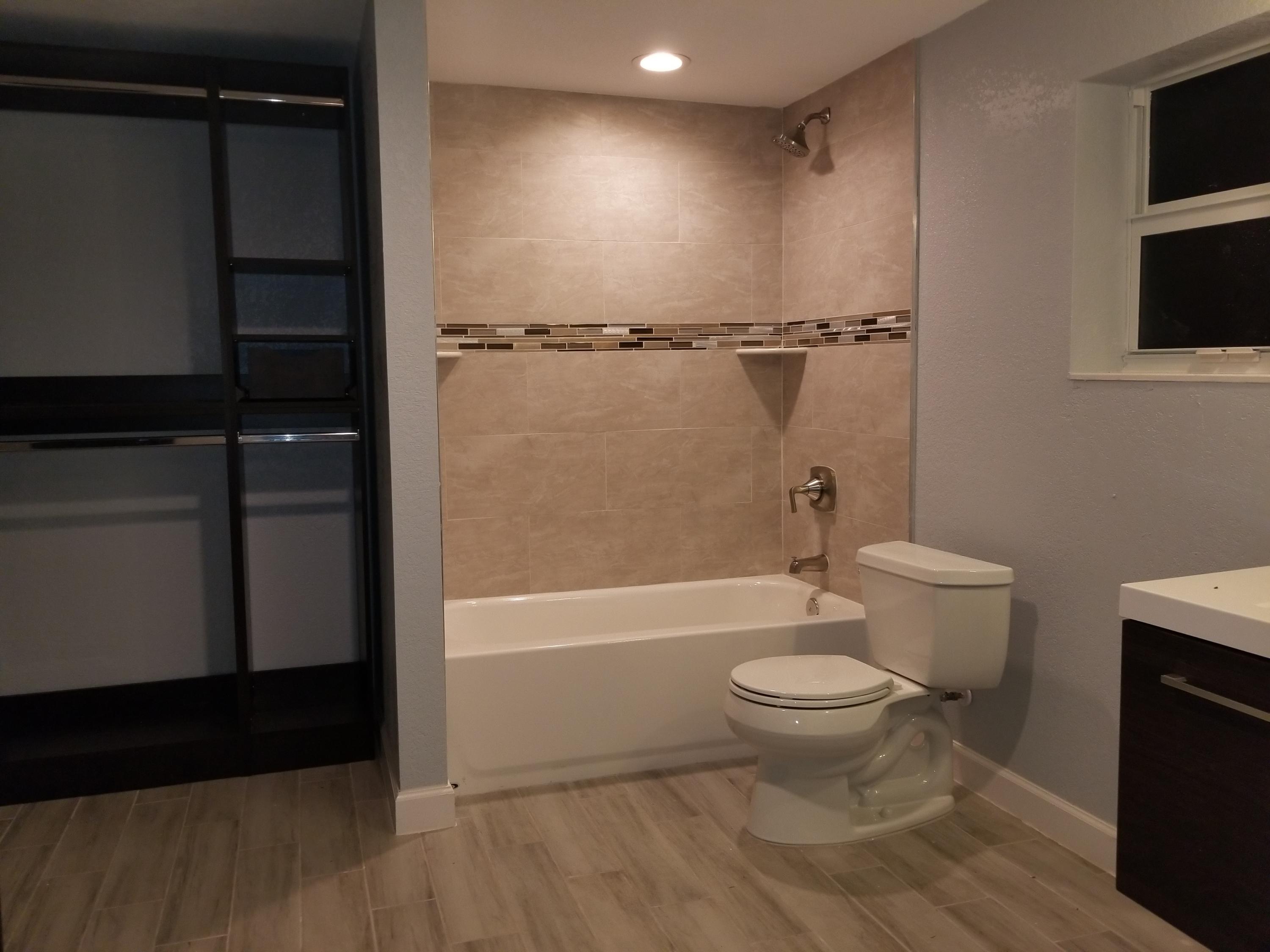 1221 Highview Road Lake Worth, FL 33462 - Photo 11 of 20 a bathroom with a toilet and a shower