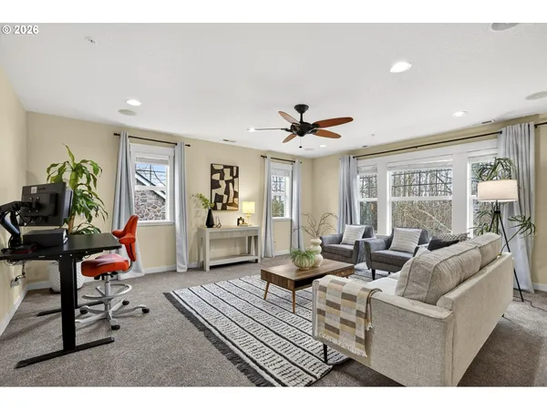 a living room with furniture and a rug