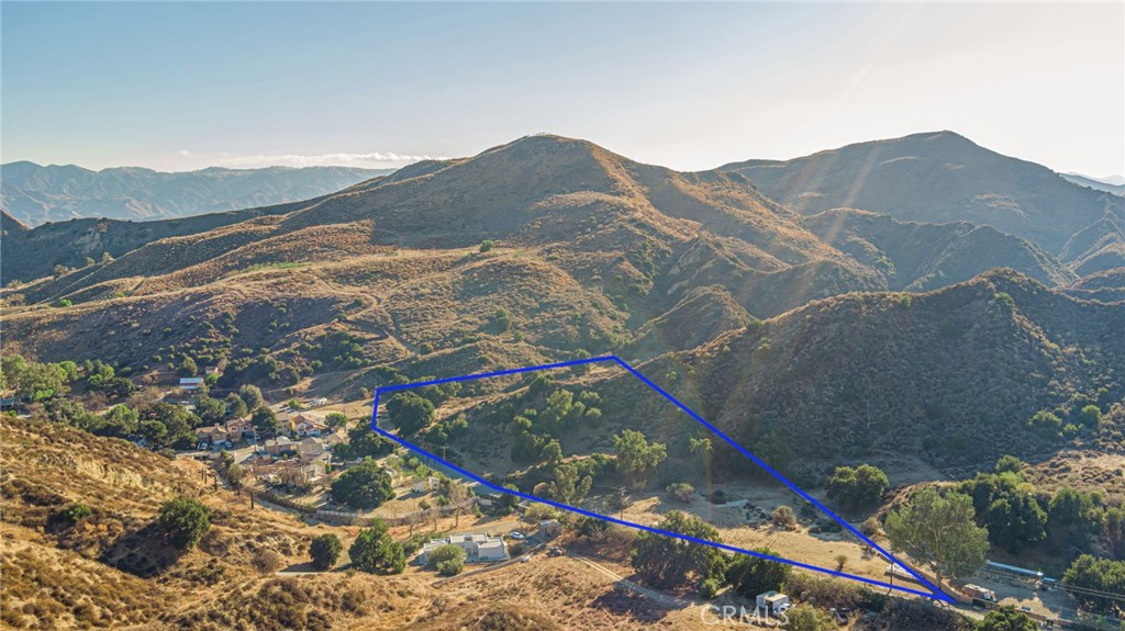 31400 San Martinez Road Castaic, CA 91384 - Photo 3 of 25 a view of a house with a mountain and a forest