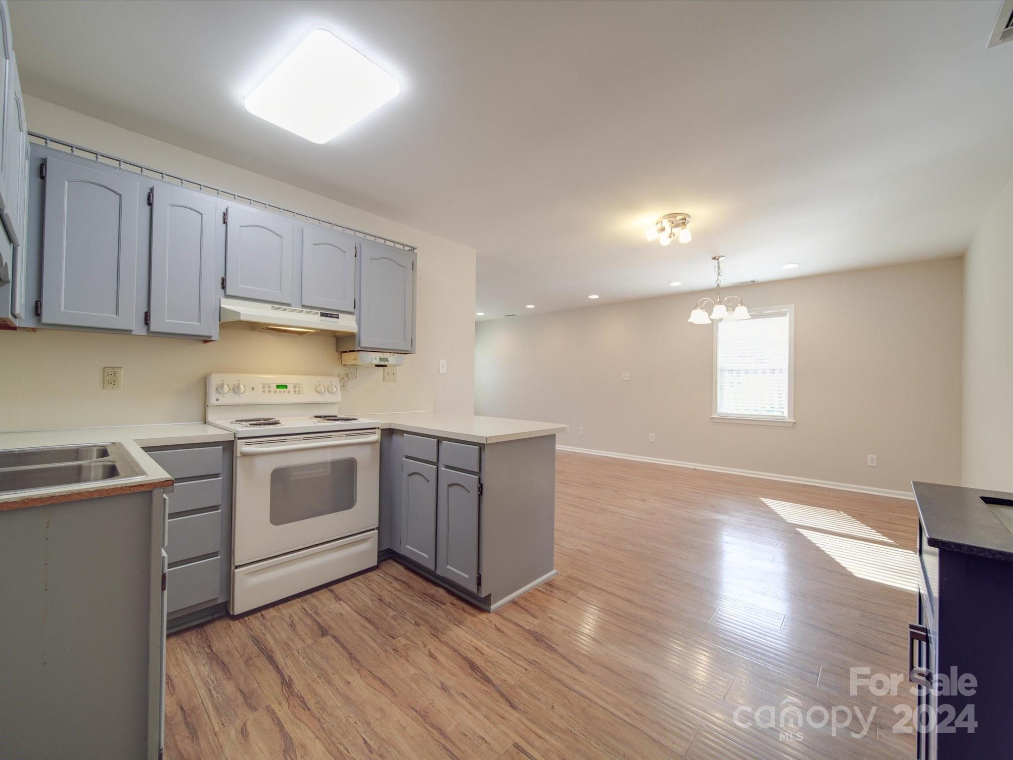 3806 Dusty Hollow Road Monroe, NC 28110 - Photo 11 of 21 a kitchen with a white cabinets and white appliances