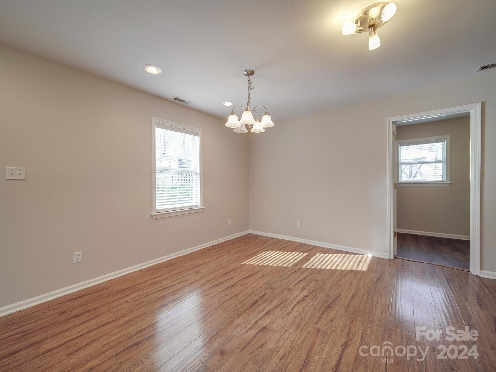 3806 Dusty Hollow Road Monroe, NC 28110 - Photo 18 of 21 a view of livingroom with window and hardwood floor