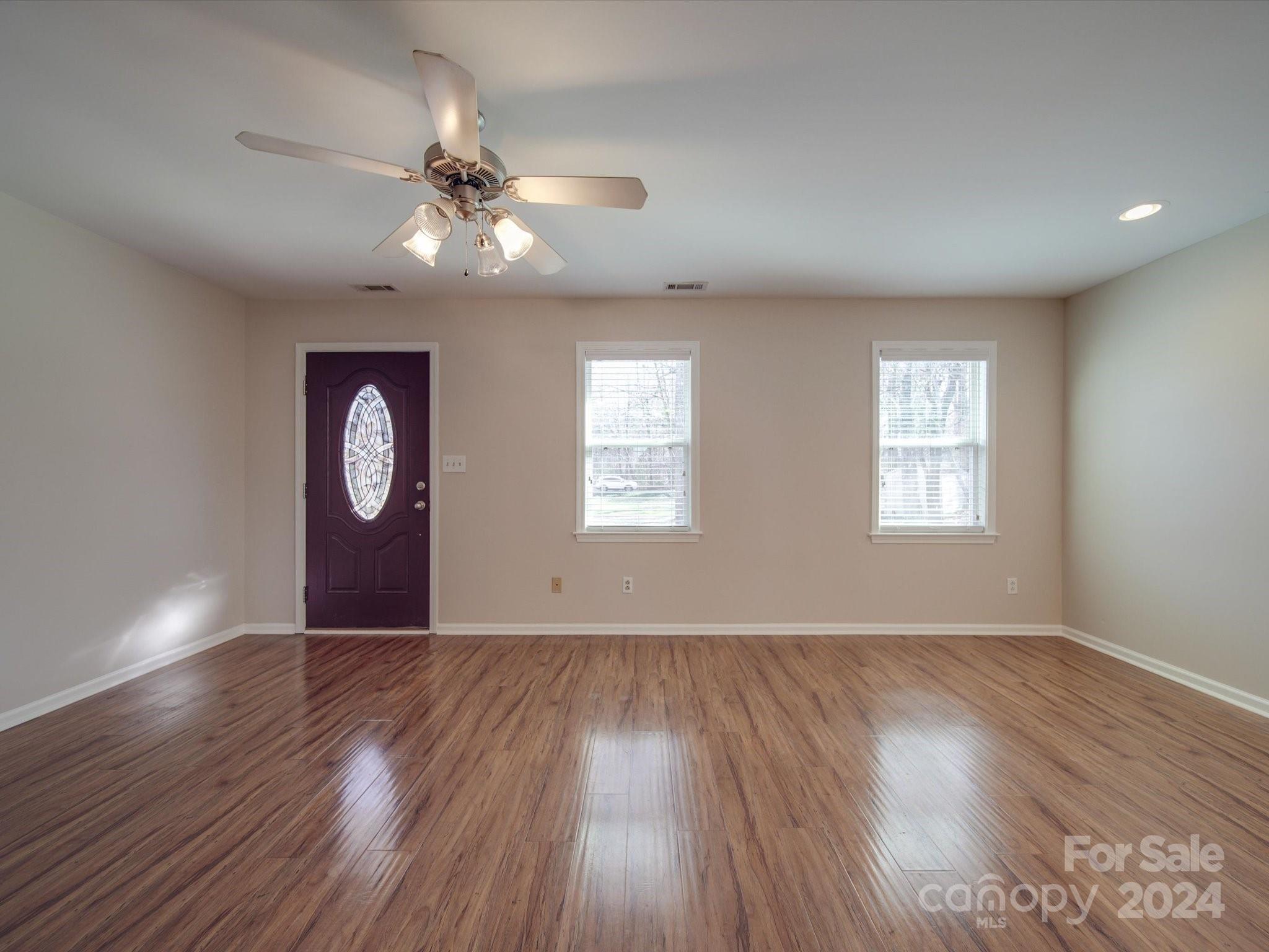 3806 Dusty Hollow Road Monroe, NC 28110 - Photo 21 of 21 a view of an empty room with wooden floor and a window