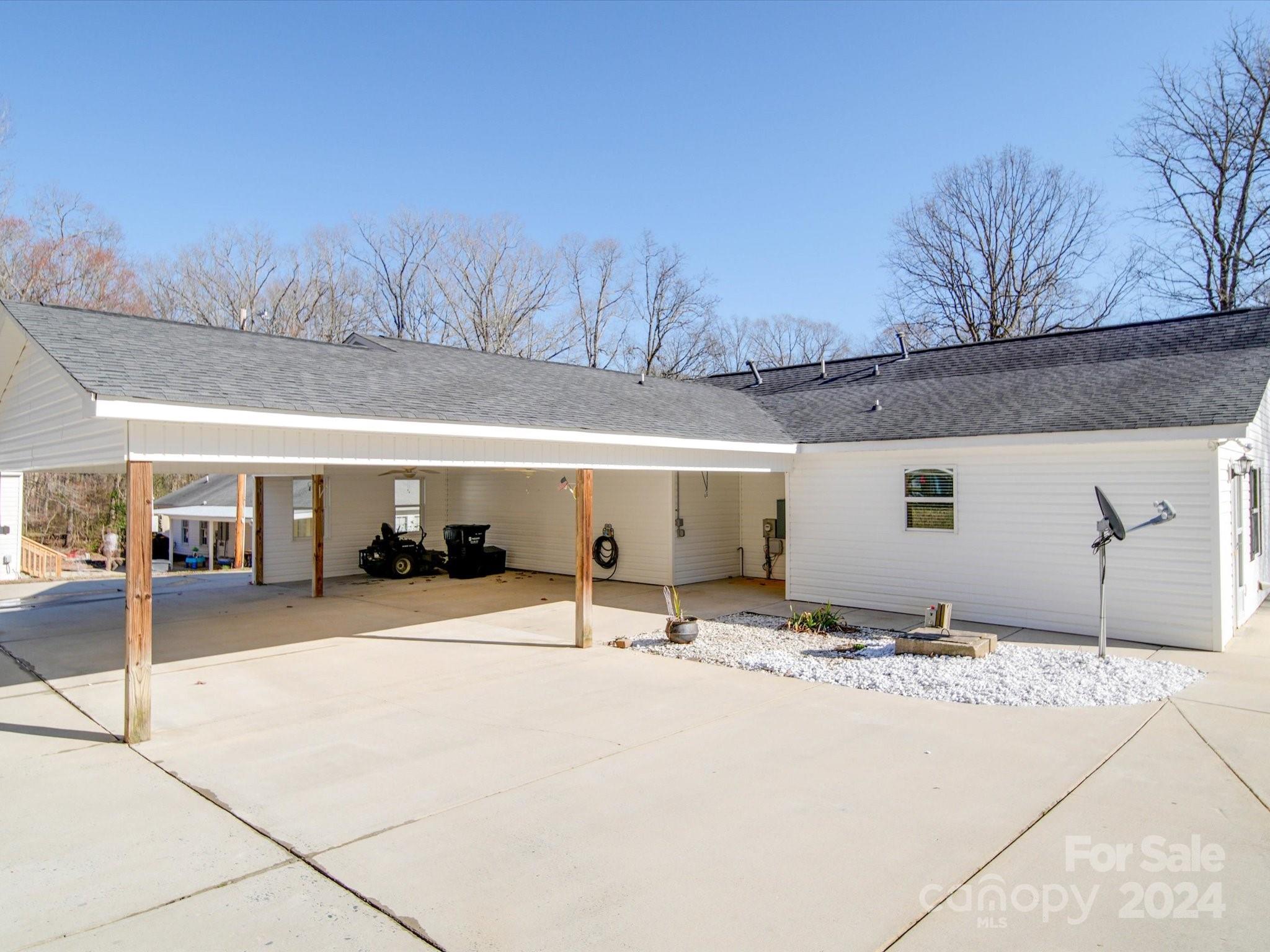 3806 Dusty Hollow Road Monroe, NC 28110 - Photo 3 of 21 a view of a house with snow on the road