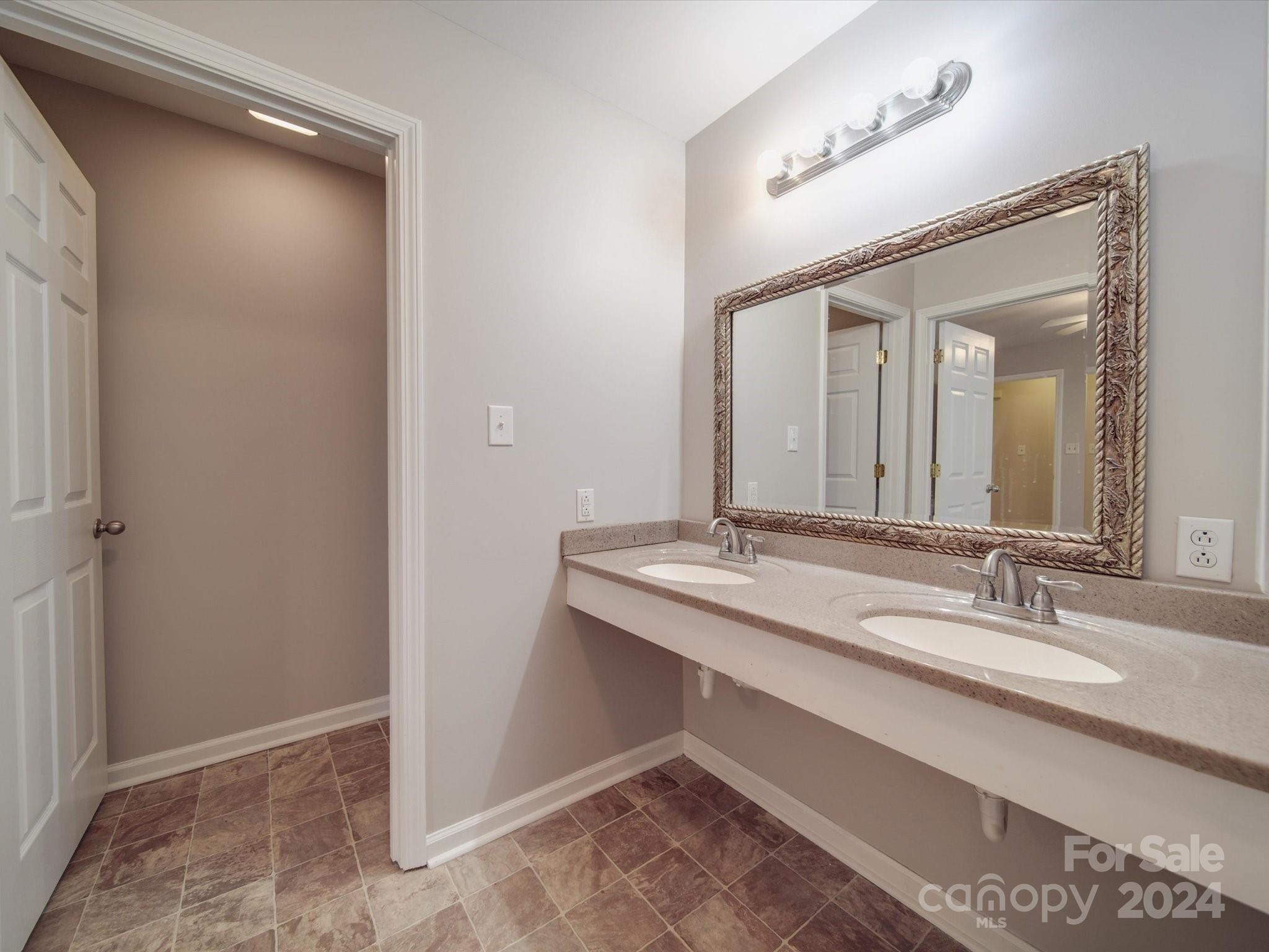 3806 Dusty Hollow Road Monroe, NC 28110 - Photo 9 of 21 a bathroom with a sink and a mirror