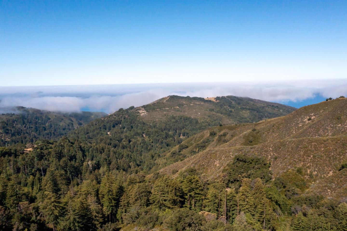 37811 Palo Colorado Road Carmel, CA 93923 - Photo 8 of 14 an aerial view of mountain with sunset