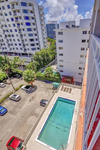 a white house with a yard and furniture