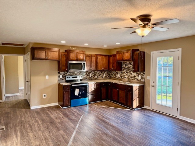 403 South High Street Tullahoma, TN 37388 - Photo 3 of 17 a kitchen with stainless steel appliances kitchen island granite countertop a stove refrigerator and a sink