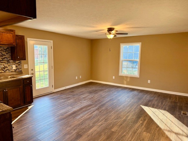 403 South High Street Tullahoma, TN 37388 - Photo 5 of 17 a view of an empty room with a window and wooden floor