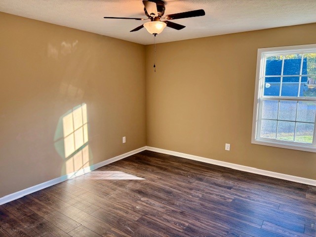 403 South High Street Tullahoma, TN 37388 - Photo 7 of 17 an empty room with wooden floor chandelier fan and windows