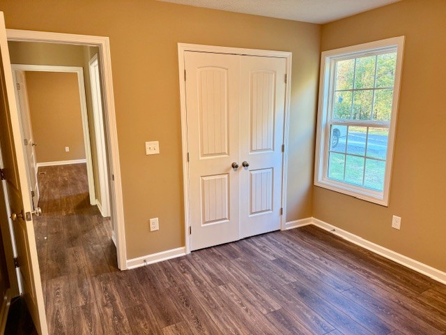 403 South High Street Tullahoma, TN 37388 - Photo 9 of 17 an empty room with wooden floor and windows