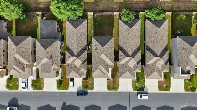 front view of multiple houses with a street