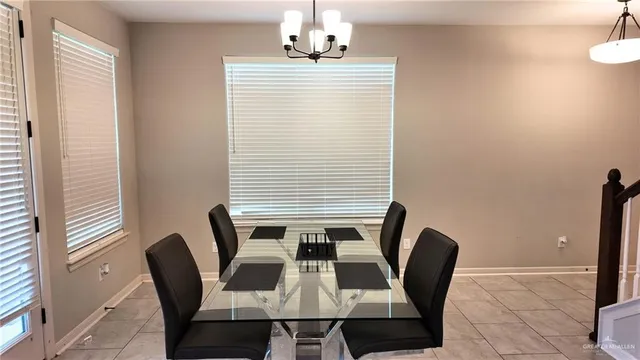a view of a dining room with furniture and window