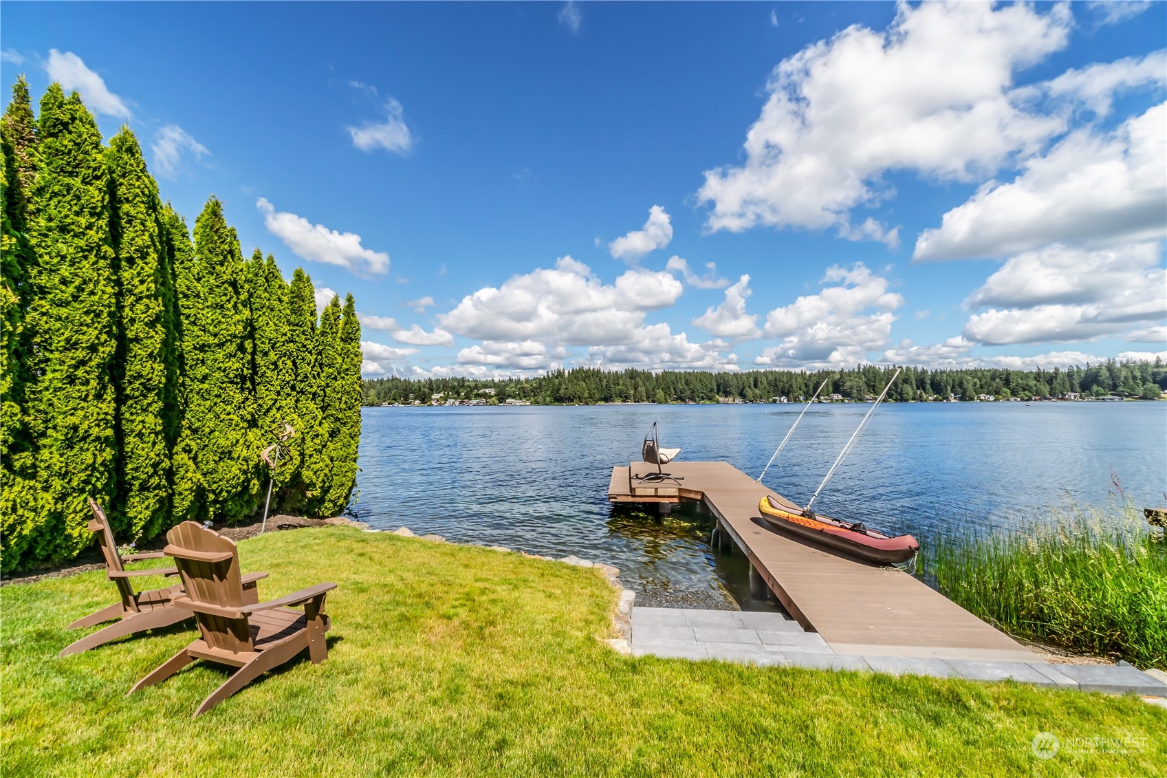 15333 West Lake Goodwin Road Stanwood, WA 98292 - Photo 28 of 39 a view of a lake with couches in the patio