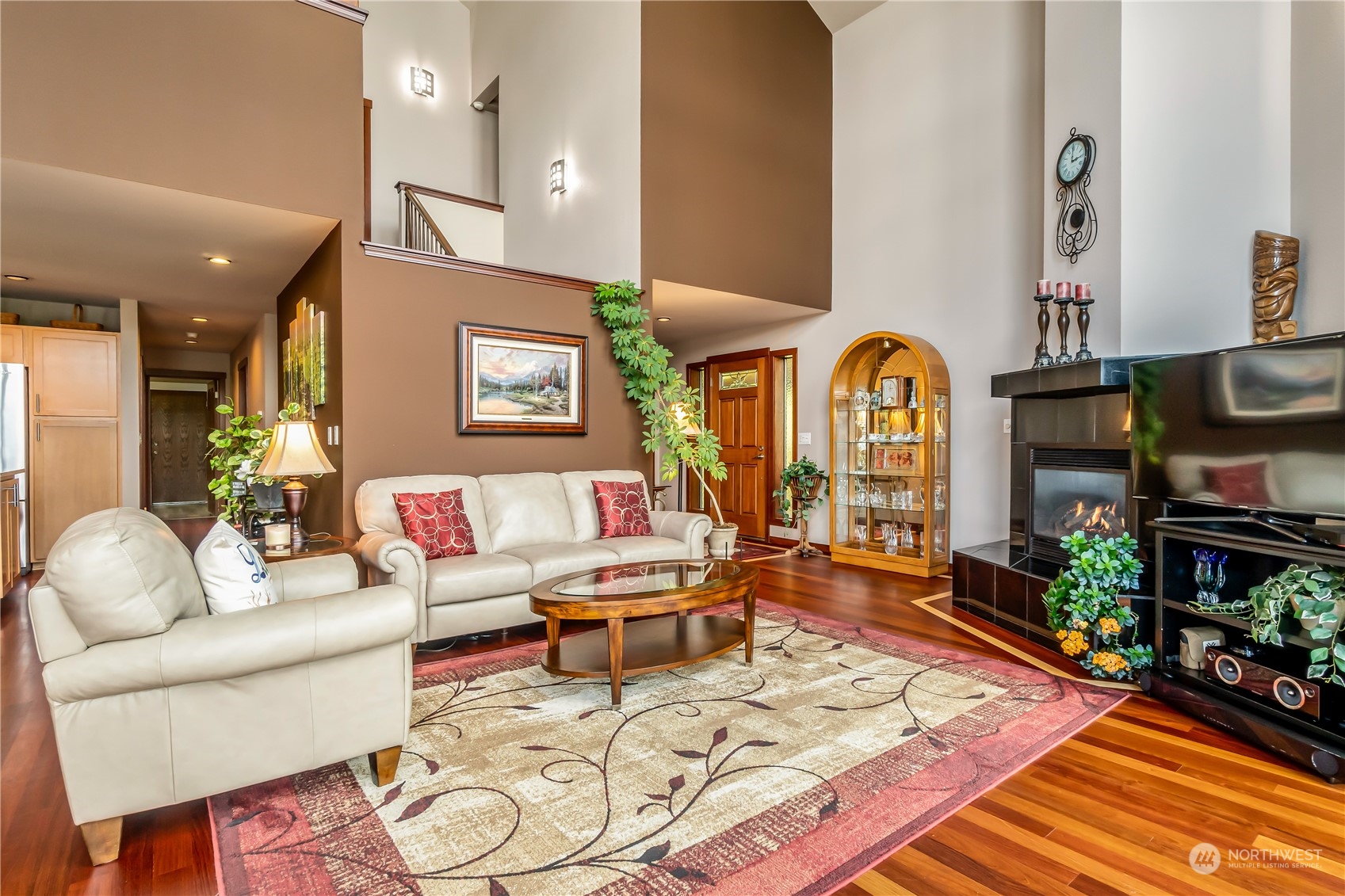 15333 West Lake Goodwin Road Stanwood, WA 98292 - Photo 5 of 39 a living room with furniture fireplace and wooden floor