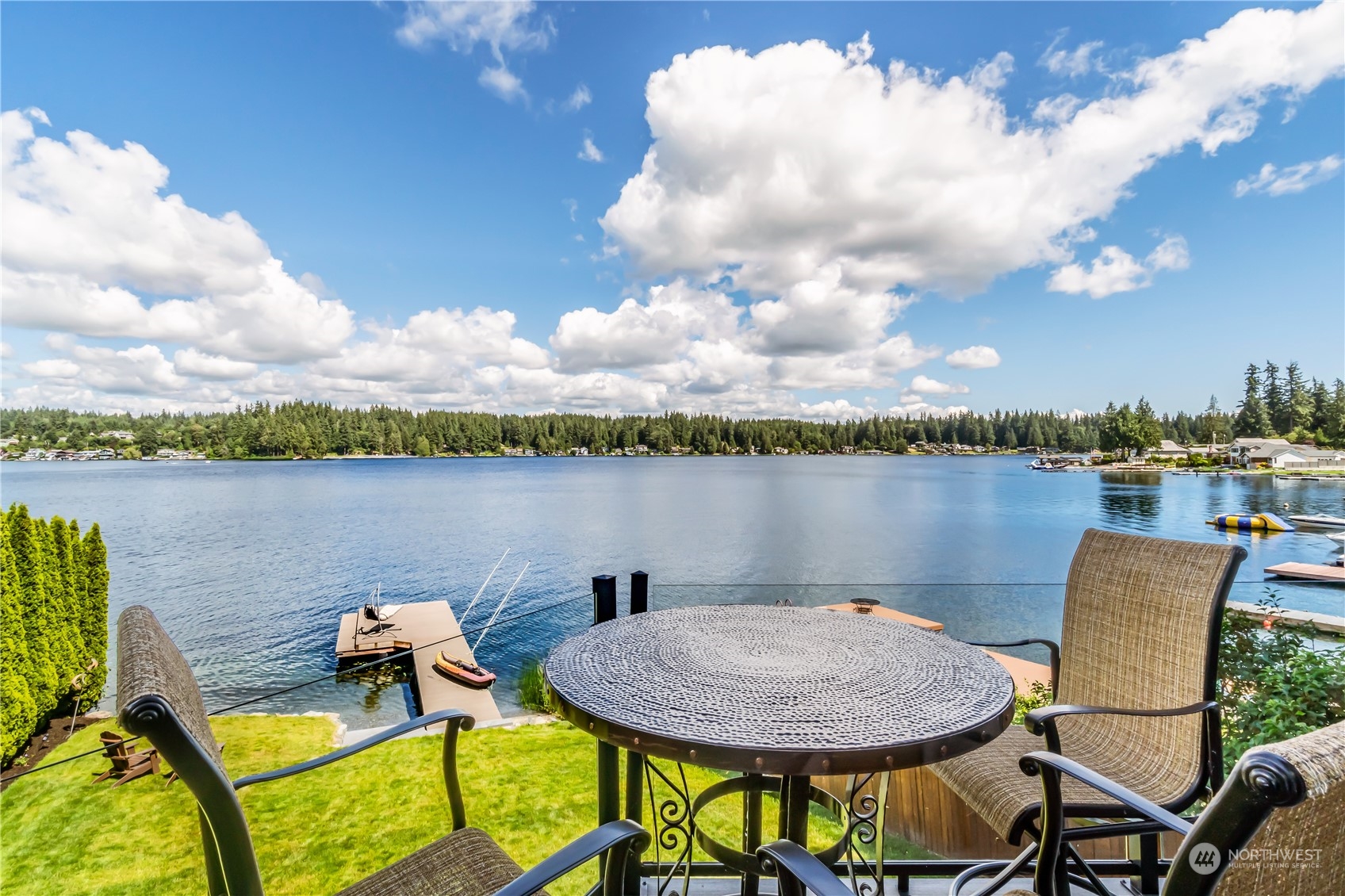 15333 West Lake Goodwin Road Stanwood, WA 98292 - Photo 9 of 39 a view of a lake with table and chairs