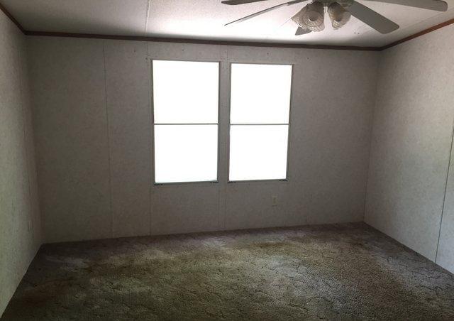 6146 Lake Ella Road Crestview, FL 32539 - Photo 6 of 12 an empty room with a window
