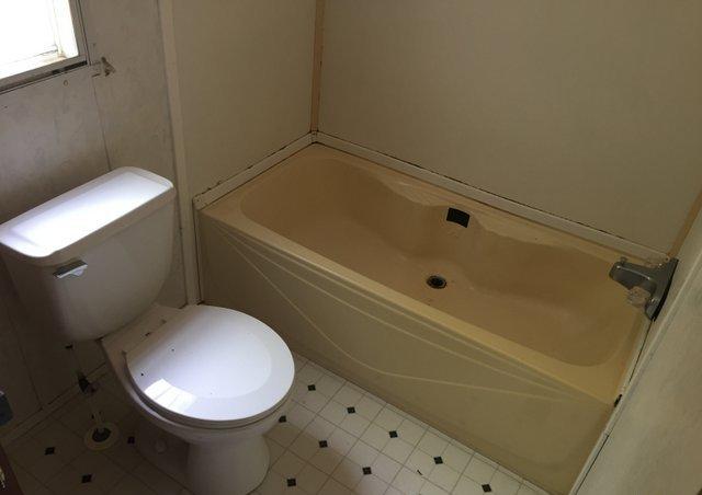 6146 Lake Ella Road Crestview, FL 32539 - Photo 10 of 12 a bathroom with a toilet and a sink