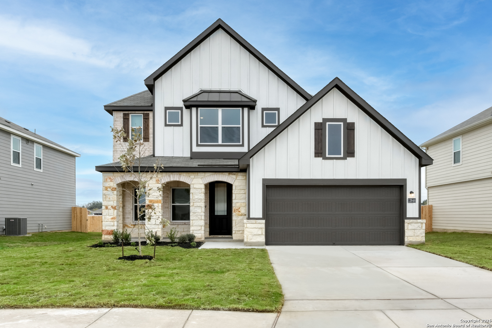 12848 Red Apple Road Schertz, TX 78154 - Photo 1 of 37 a front view of a house with a yard