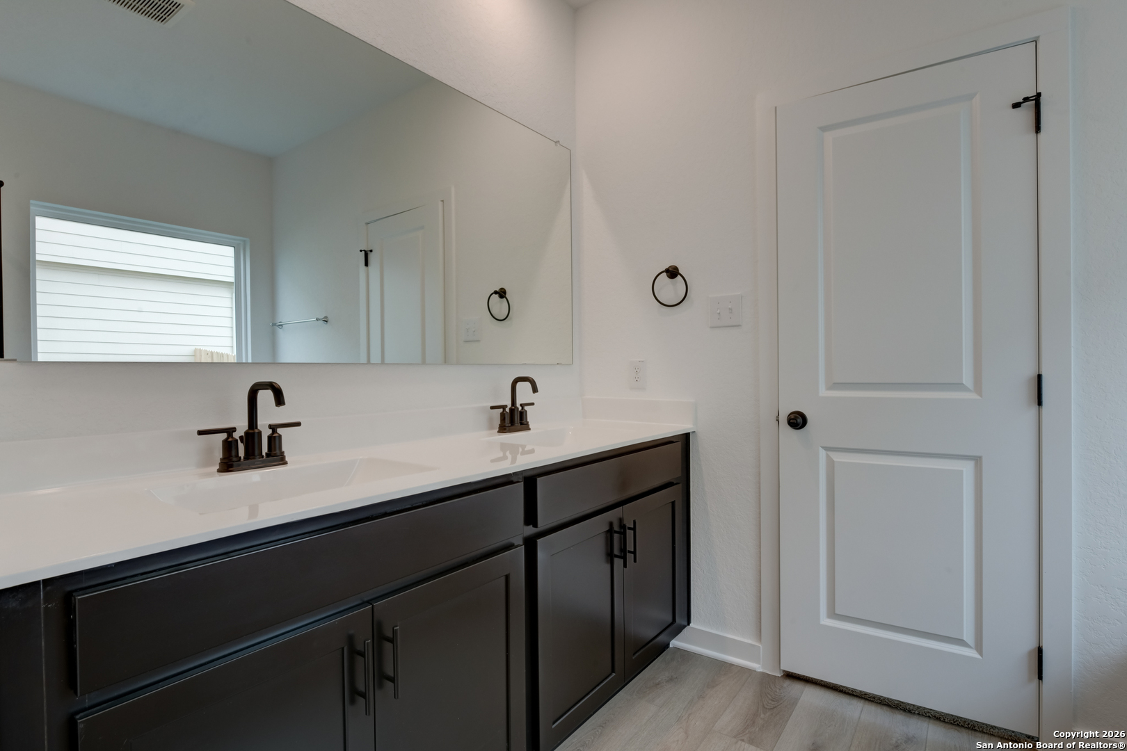 12848 Red Apple Road Schertz, TX 78154 - Photo 20 of 37 a view of a sink with a mirror