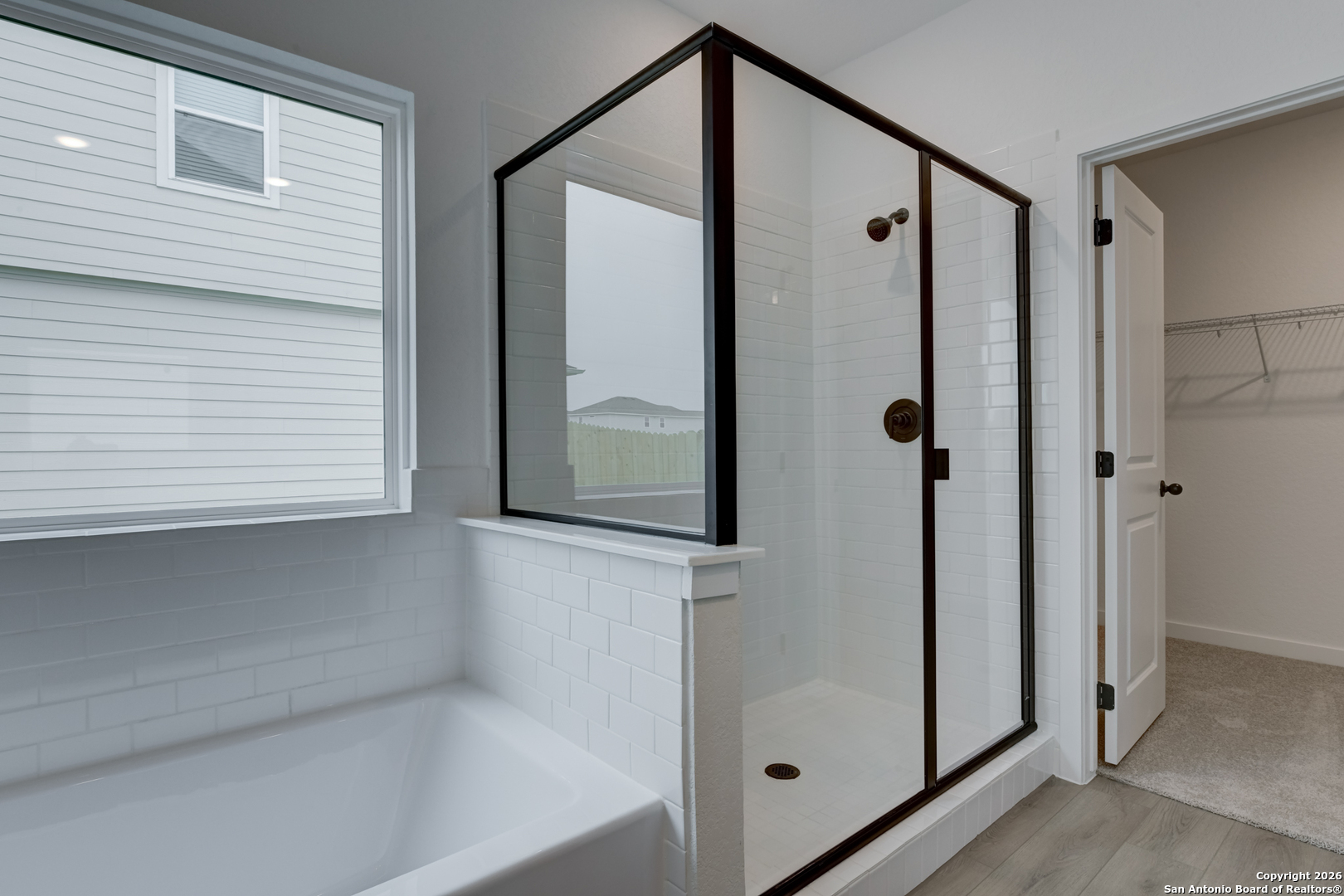 12848 Red Apple Road Schertz, TX 78154 - Photo 21 of 37 a bathroom with a shower and a mirror