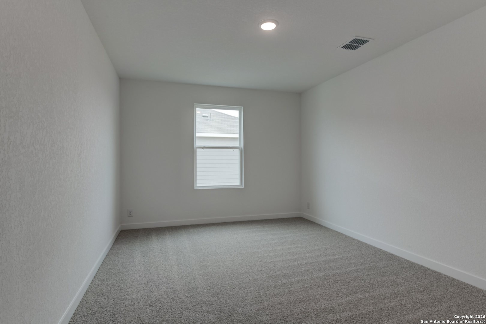 12848 Red Apple Road Schertz, TX 78154 - Photo 32 of 37 an empty room with a window